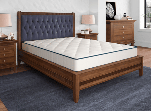 clean neat bedroom set with white mattress on wooden frame