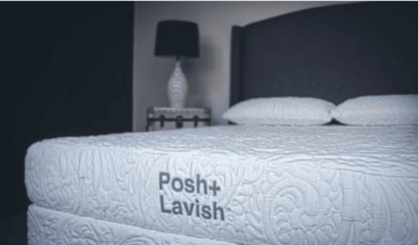 close up of left facing white embroidered mattress